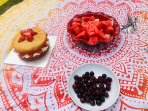 Photo of watermelon, cherries and strawberries and cream cake