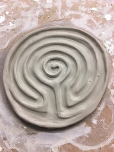 Photo of a clay labyrinth being made