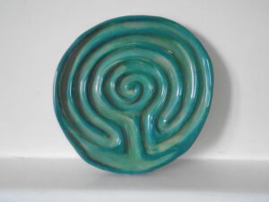 Photo of a green glazed clay labyrinth